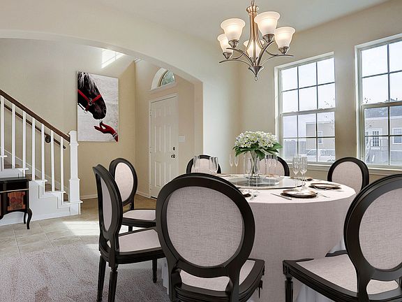 Dining room tucked off foyer