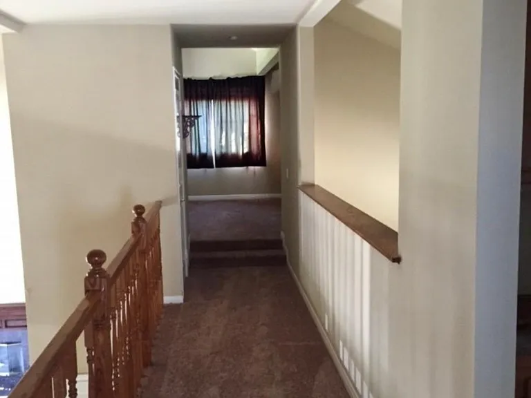 upstairs landing and center hall between loft/office and bedrooms