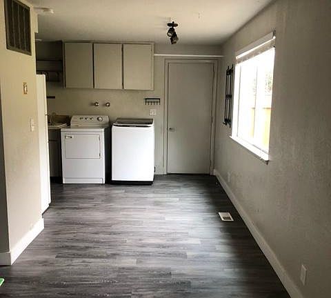 Dining area, back door, washer/dryer