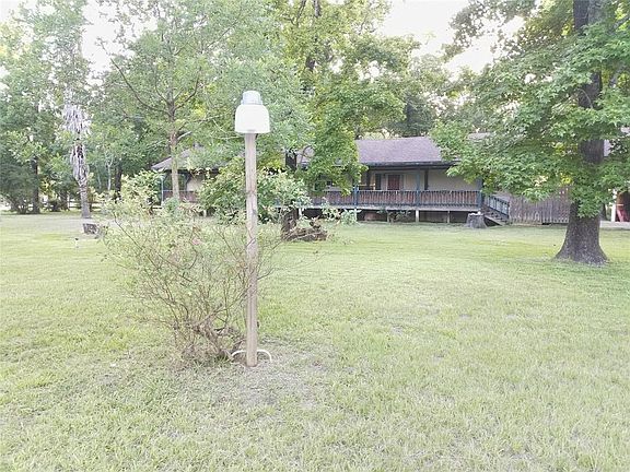 Corner lot with lots of trees.