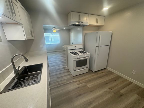 Kitchen with new cabinetry, countertops, electrical and plumbing