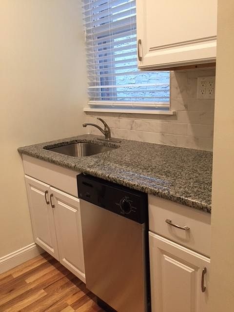 Kitchen with granite counter tops and porcelain tile back splash/SS appliances