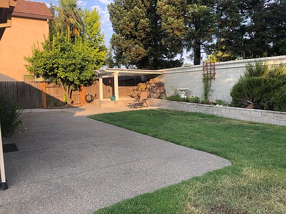 Backyard and there is a HUGE grass area to the right