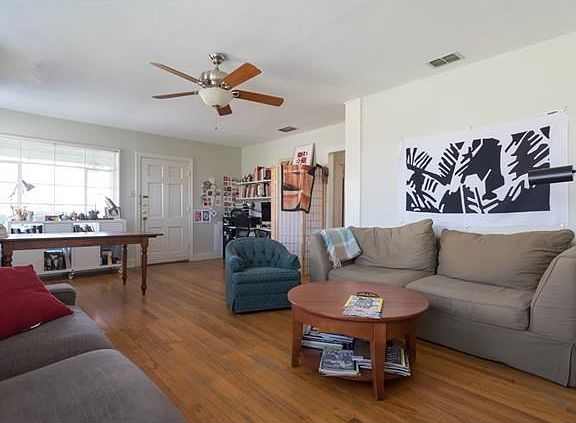 Wide living-room shot showing off the wood floors