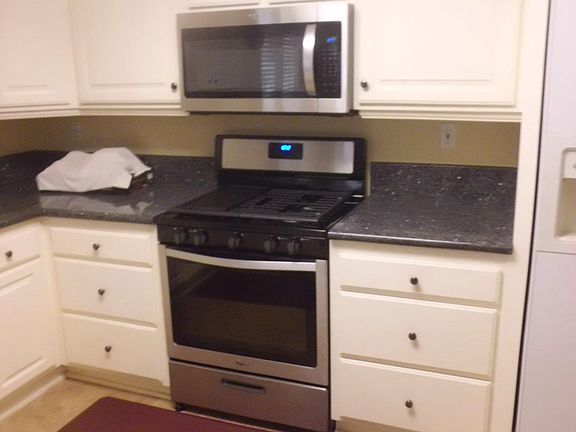 Kitchen- Brand New Stove & Microwave