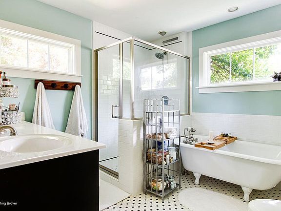 The relaxing clawfoot tub, stand-up shower and double vanity make this large bathroom work.