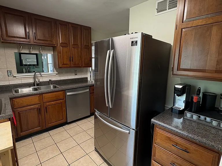 Bright L-shaped Kitchen with pass-through to dining nook