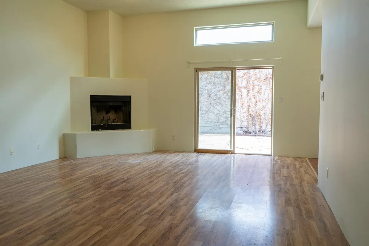 Living room with wood burning fireplace.Sliding door to yard and patio. - 4209 Vuelta Colorada