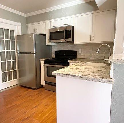Stainless steel appliances in kitchen.