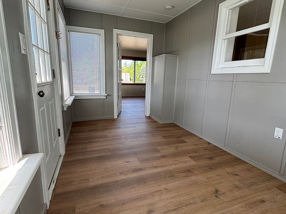 Sunroom leads into the living room through a glass-paned door that can be closed for decor or privacy.