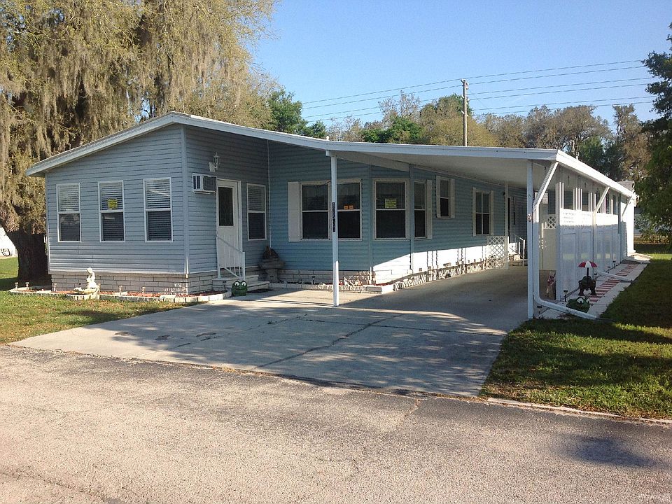 Front of Home with attached Carport