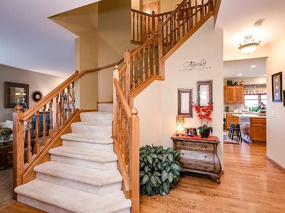 Solid oak 6 panel doors, trim, custom cabinetry and this showcase stairway.