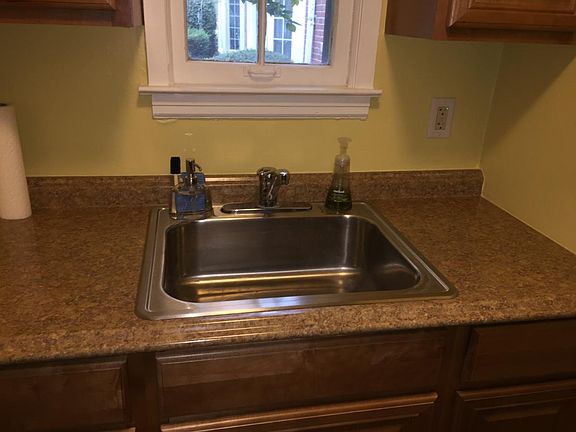 Kitchen sink, newer countertops & cabinets