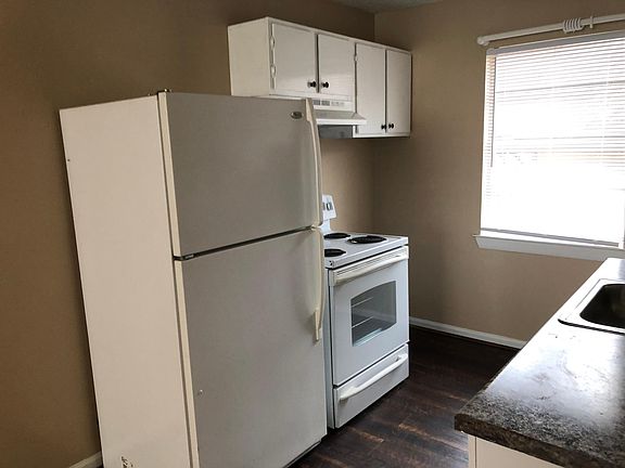 Kitchen-Stove, refrigerator, dishwasher, place for washer & dryer.