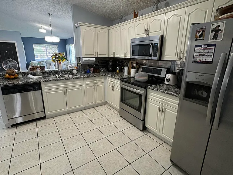 702 NW 208th Ter — Photo 9
