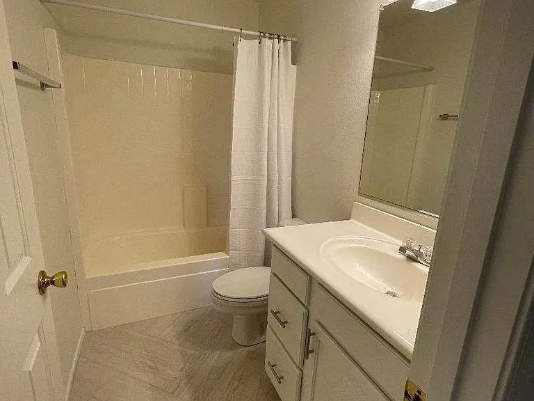 2nd Floor Bath with herringbone tile and storage closet