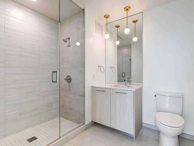 A bright and elegant bathroom retreat, designed for comfort and clean, contemporary living.