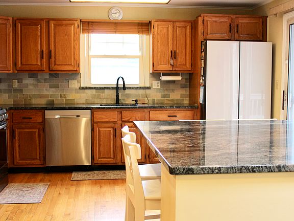 Large Kitchen w/ Gas Range Leads out to Deck
