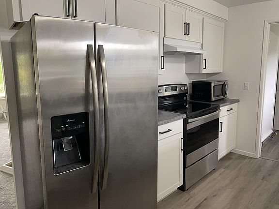 Updated kitchen and adjoining dining area with modern finishes to cook, gather, and enjoy.