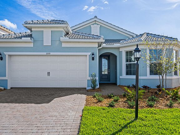 Summerwood exterior with charming bay window paved driveway