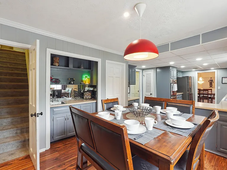 Eat-In Kitchen Area with Bar Area and staircase up to Master Bedroom -Main Level