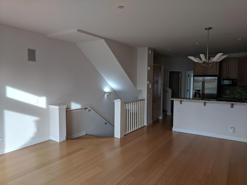 Enter from front door or garage into open kitchen/living room