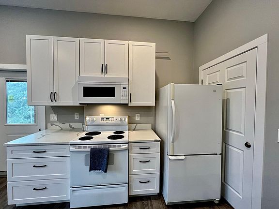Door to stairwell behind fridge remains closed and locked at all times
