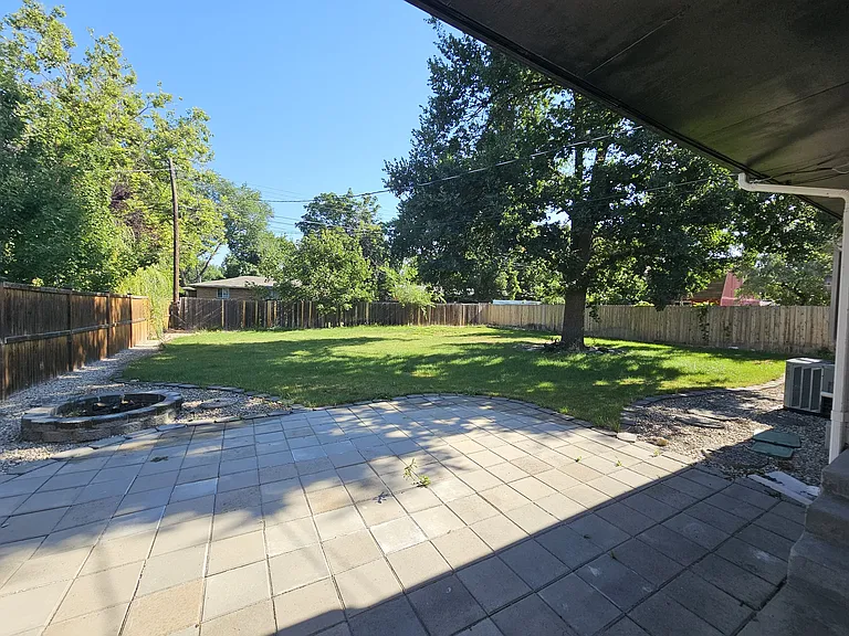 Huge Backyard! Patio pavers with firepit, expansive lawn and shade.