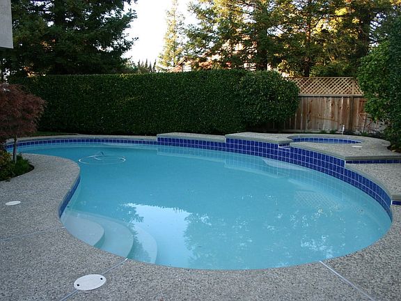 Spaciaous yard with pool and spa.