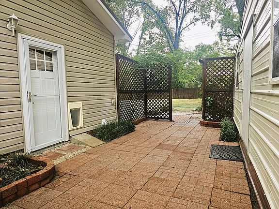 Patio eclosed between right side of home and 12' x 24' locking storage room.