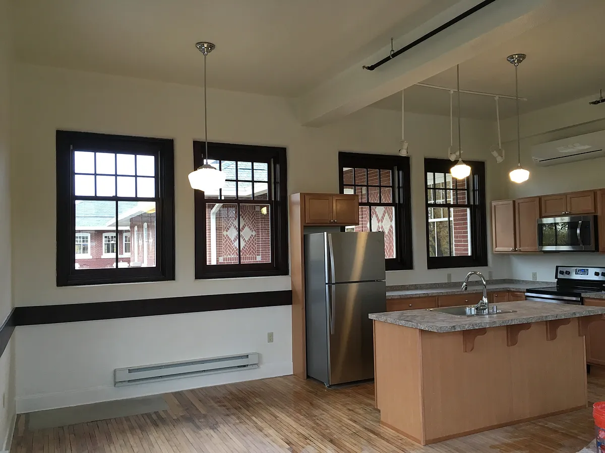 Larger 2 bedroom open concept kitchen windows on three sides. - 1447 Patterson Loop #207