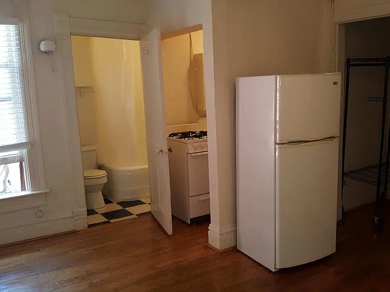 View of living area/kitchen/bath