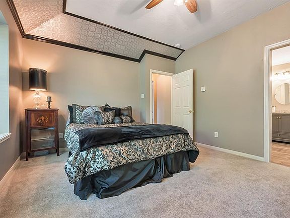 Master Bedroom has recent carpet, large window seat window overlooking pool, and newly remodeled ensuite Master Bath.