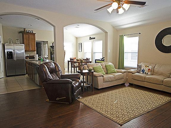 Open-Concept Living with Kitchen Flowing into Den Area