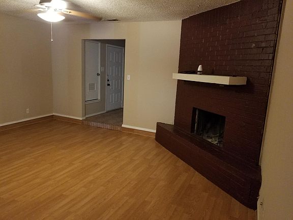 Large living room with a natural fireplace