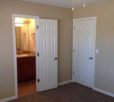 Bedroom looking into bathroom
