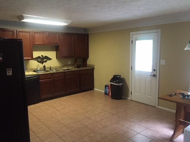 Eat in kitchen with granite counter tops and upgraded applia