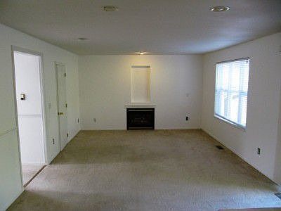 Large family room just off the kitchen w/ gas fireplace- entire home has been freshly painted!