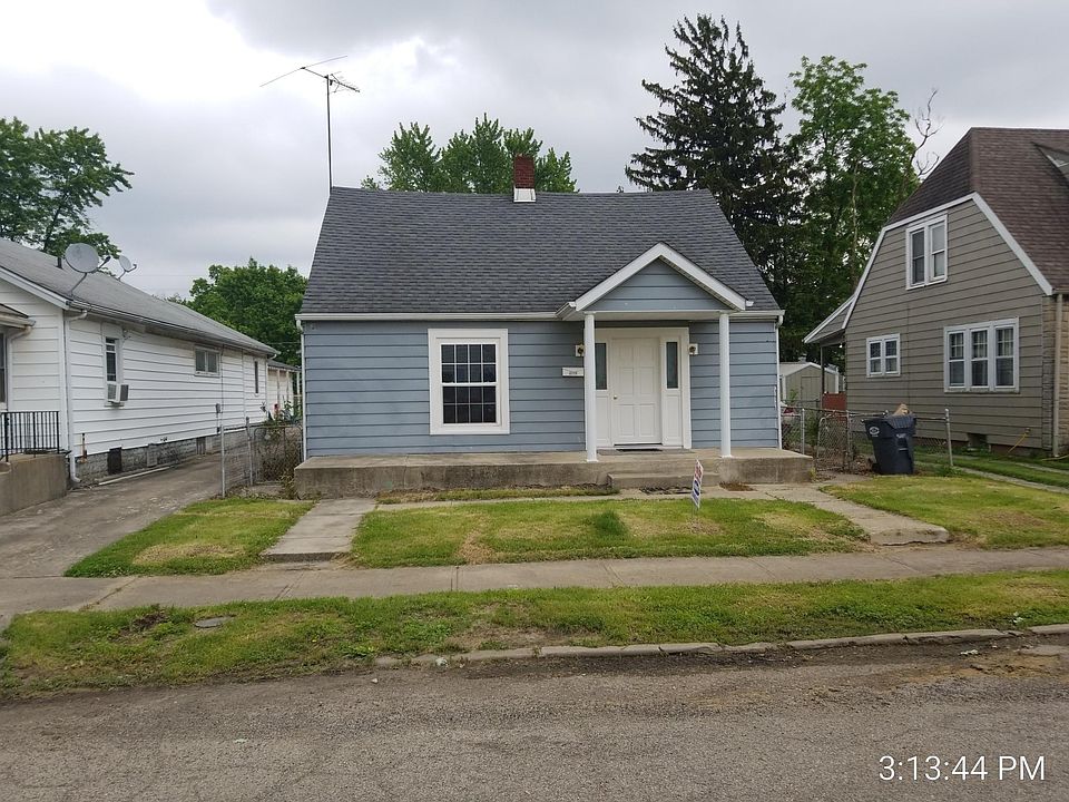 Front of home with replacement windows throughout.