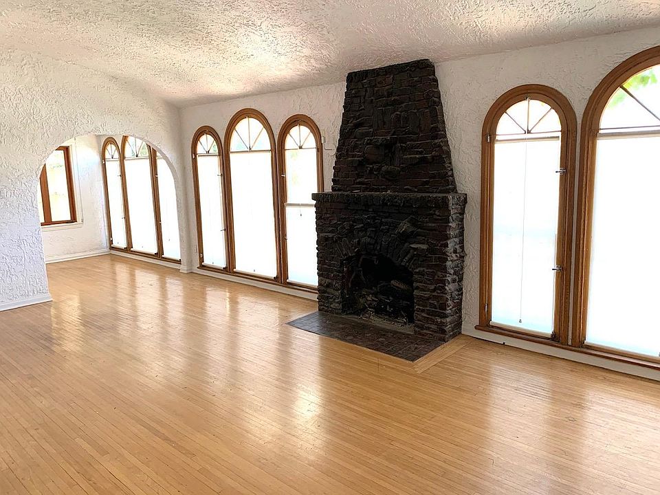 Gorgeous windows line the living room and bonus room.
