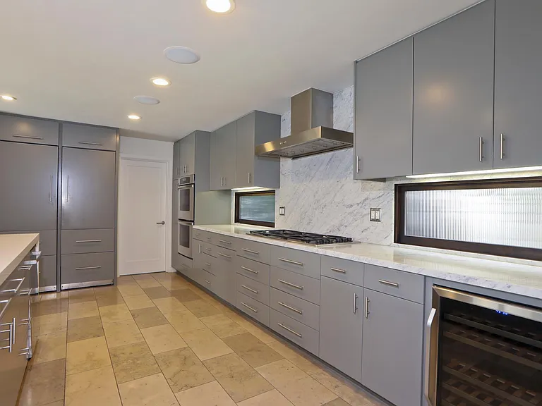 Updated kitchen with wine storage, gas appliances, stainless sink, 2 built-in refrigerators