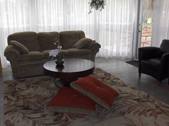 Large family room also has twin day bed.