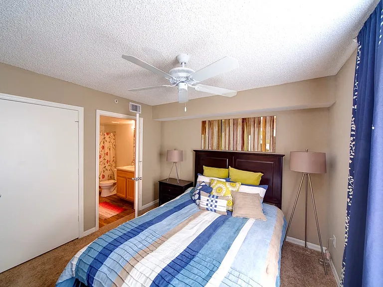Large bedroom with a ceiling fan at Gregory Cove in Jacksonville, FL