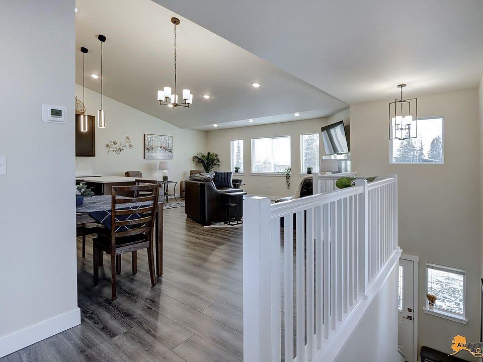 Top of stairs, looking at the Living/Kitchen area