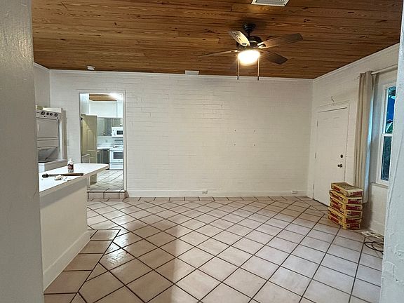 Spacious living area with high ceilings.