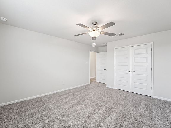 Secondary Bedroom in Riverbend at Double Eagle at Meritage Homes in Austin, TX.