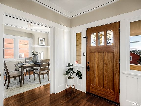 Formal entryway opens to dining room on one side and living room on the other.
