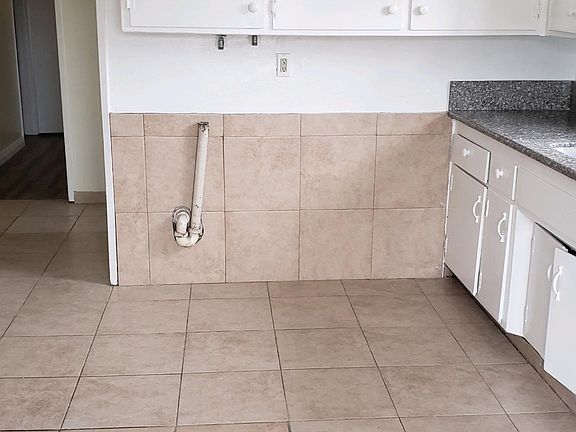 Washer dryer hookups under cupboard