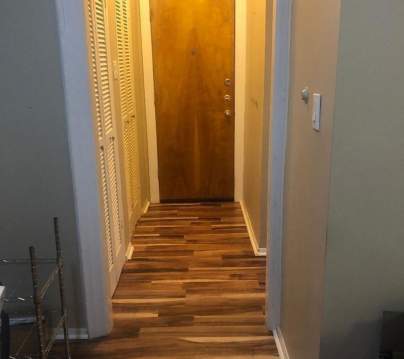 A view of the entrance to the apartment that has 2 very large walk-in closets adjacent upon entering