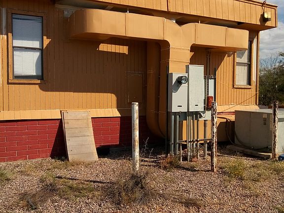 West side of the building and electric panels